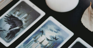 tarot cards with candle 1200x628